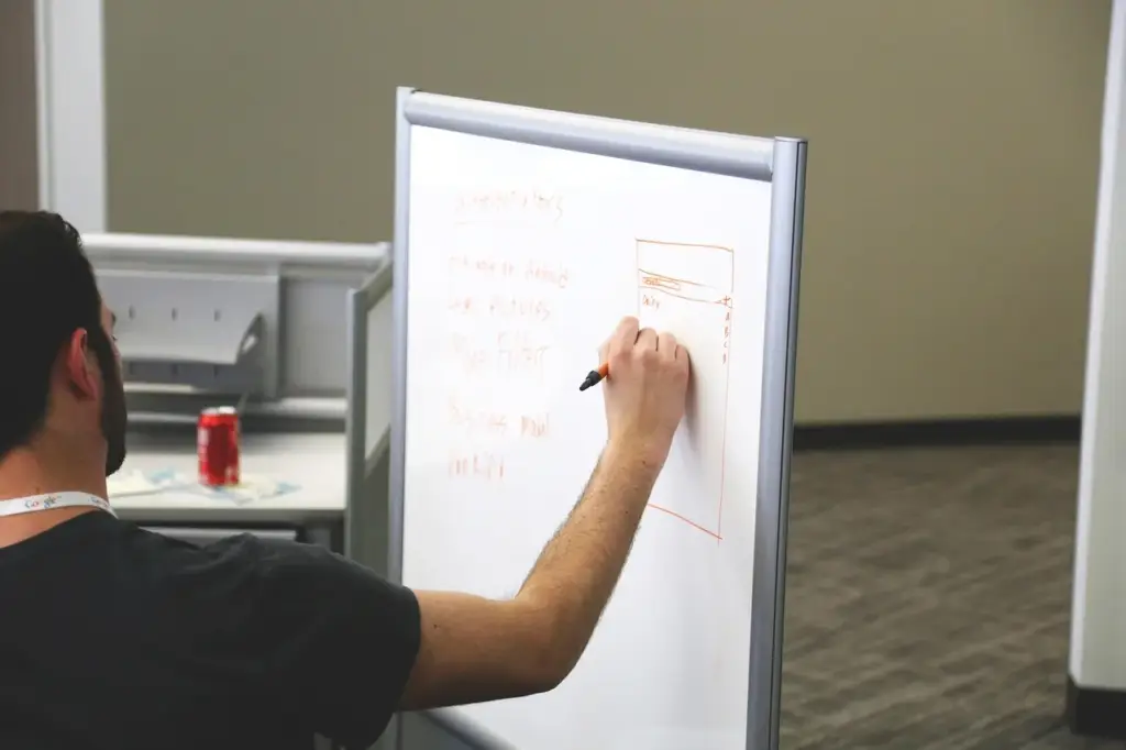 Trie diagram on whiteboard showing nodes and paths for autocomplete implementation